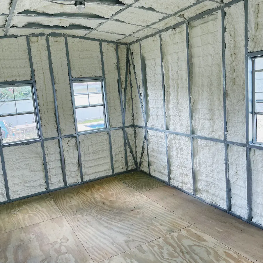 Closed-cell spray foam insulation applied to wall cavities in a residential project in Fulton